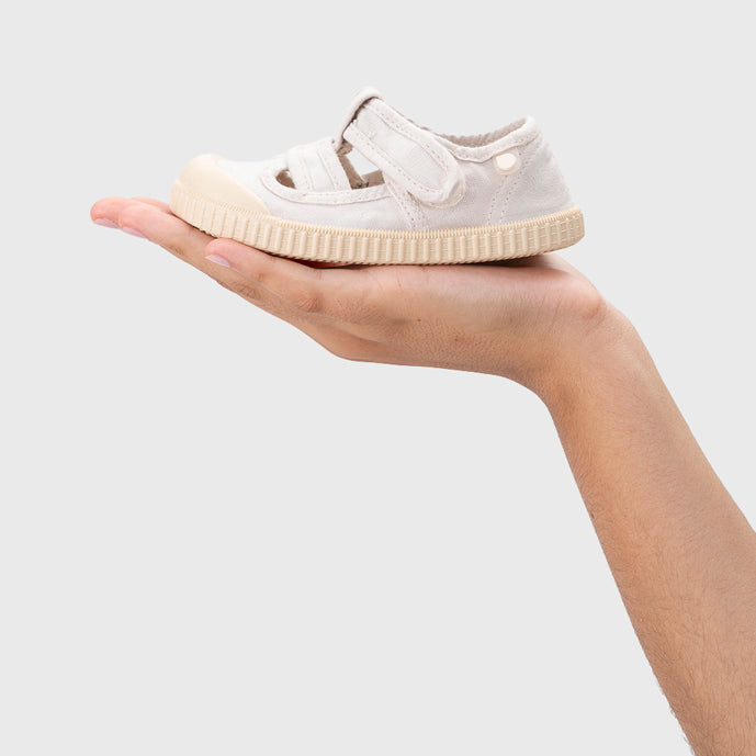 Open canvas shoes barefoot concept, Ice